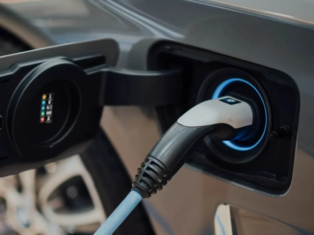 Closeup on a charger plugged into an electric vehicle